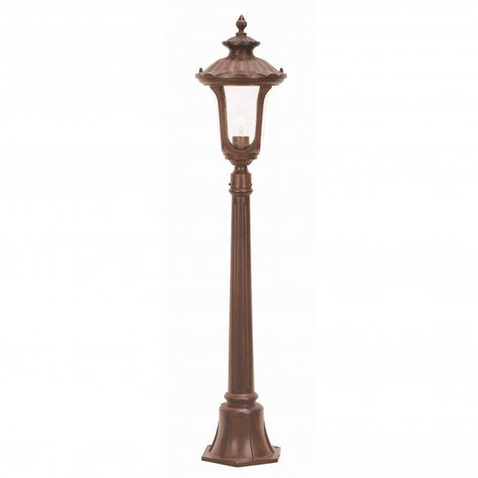 Chicago Pillar Lantern Small with a rusty bronze patina finish
