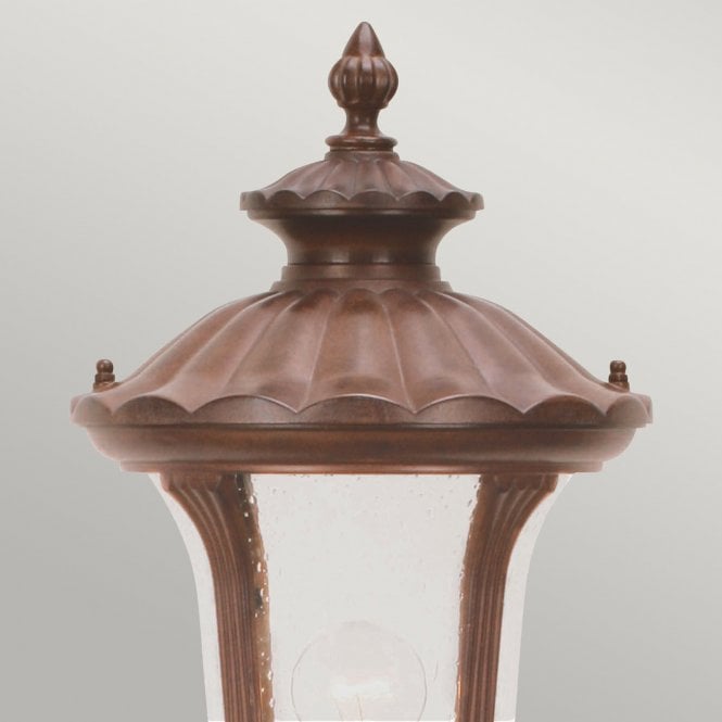 Chicago Pillar Lantern Small with a rusty bronze patina finish