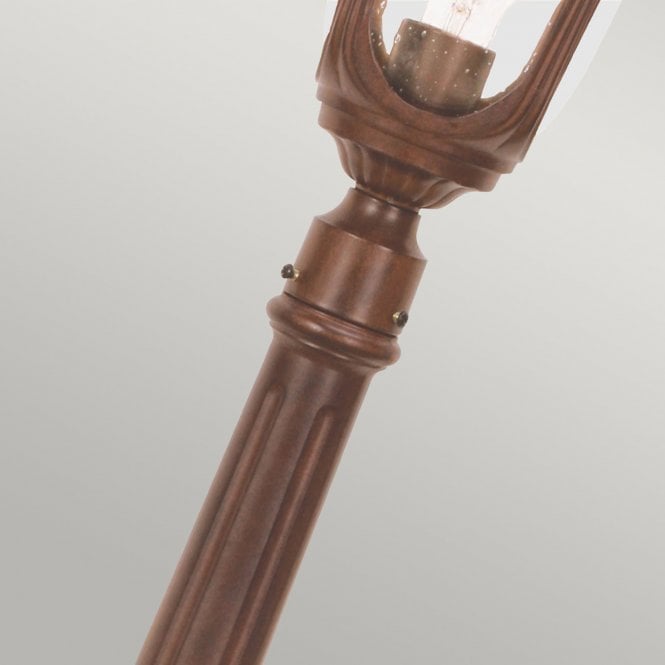 Chicago Pillar Lantern Small with a rusty bronze patina finish